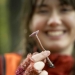 woman holding a mushroom