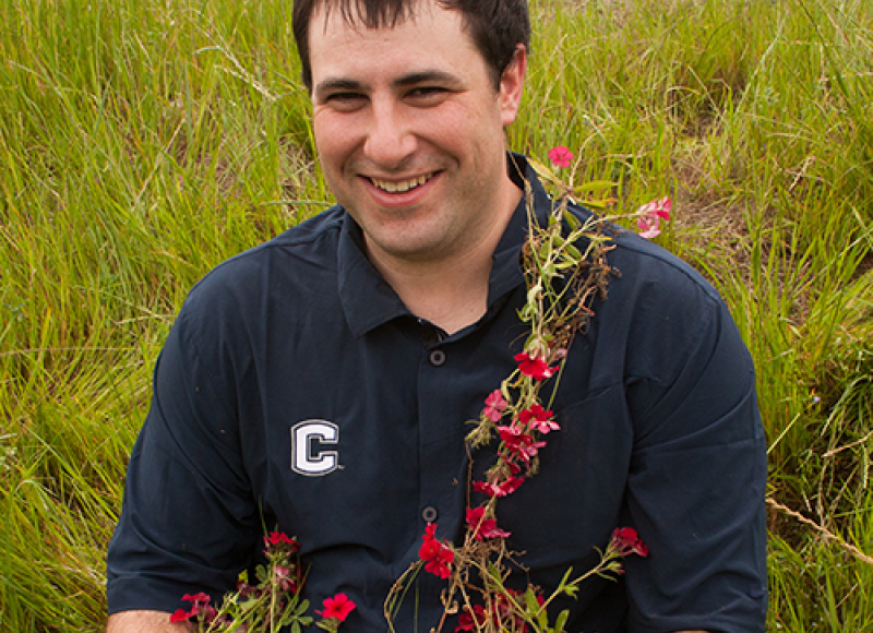 scientist covered in flowers