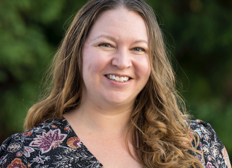 Jessica Lodwick in front of leafy background