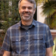 Jeff Anderson standing outside in Cordley's courtyard