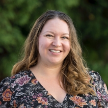 Jessica Lodwick in front of leafy background